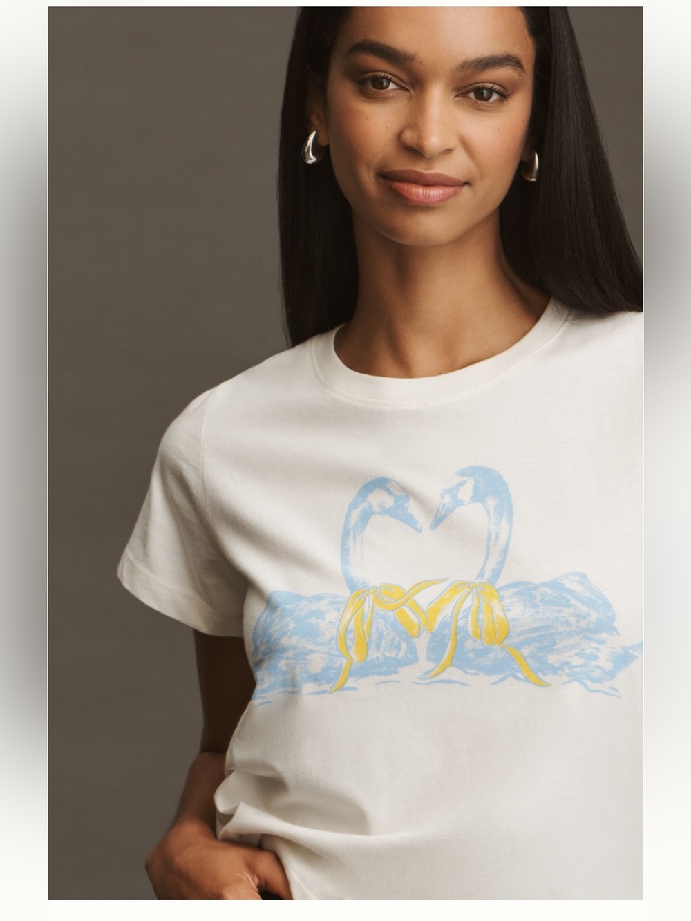 Anthropologie Cream Short Sleeve Tee with Blue Swan Graphic and Yellow Bows